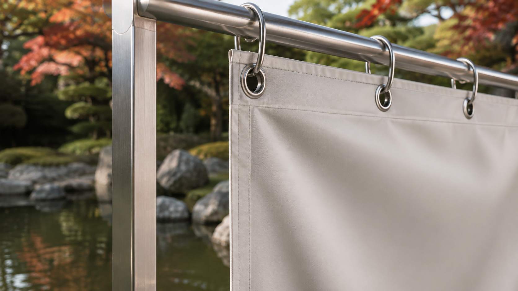 metal eyelet manufacturer China, The metal eyelet manufacturer China is represented by metal eyelets installed along the top edge of the white fabric.